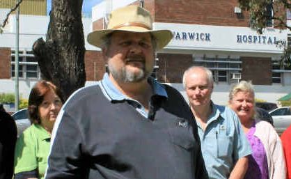 Tony Fogg (front) and operational staff from Warwick Hospital raise concerns about job security.